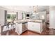 Well-appointed kitchen with a breakfast nook, stainless steel appliances, and hardwood flooring at 3816 Ernie Dr, Charlotte, NC 28269