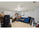 Unfinished basement with painted walls features a blue sofa at 4322 Greenhaven Ln, Gastonia, NC 28056