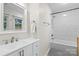 Well-lit bathroom features a tub with a shower, a vanity, and tile flooring at 4322 Greenhaven Ln, Gastonia, NC 28056