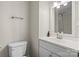 Bathroom featuring modern sink, lighting, toilet and a tiled shower with neutral decor at 4322 Greenhaven Ln, Gastonia, NC 28056