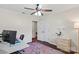 Bright bedroom features a ceiling fan, a closet, and an entryway with a view into another room at 4322 Greenhaven Ln, Gastonia, NC 28056