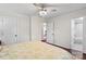 A bedroom with hardwood floors features access to a bathroom and a view into another room at 4322 Greenhaven Ln, Gastonia, NC 28056