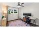 Bright bedroom setup as home office with wood floors, large windows, desk, and modern decor at 4322 Greenhaven Ln, Gastonia, NC 28056