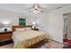 Cozy bedroom features a ceiling fan, a window, and hardwood floors with an area rug at 4322 Greenhaven Ln, Gastonia, NC 28056