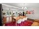 Elegant dining area with a hardwood table, soft lighting, and a stylish rug, open to the kitchen at 4322 Greenhaven Ln, Gastonia, NC 28056