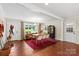 Open-concept dining area with hardwood floors, modern chandelier, and lots of natural light, perfect for gatherings at 4322 Greenhaven Ln, Gastonia, NC 28056