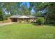 Brick home with lush green lawn and manicured landscaping, enhancing its classic appeal and curb presence at 4322 Greenhaven Ln, Gastonia, NC 28056