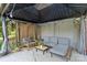 Relaxing outdoor gazebo featuring comfortable seating, a coffee table, and charming string lights at 4322 Greenhaven Ln, Gastonia, NC 28056