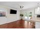 Bright kitchen area featuring hardwood floors, granite countertops, white cabinets, and stainless steel appliances at 4322 Greenhaven Ln, Gastonia, NC 28056