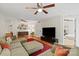 Spacious living room features hardwood floors, a ceiling fan, and access to other rooms at 4322 Greenhaven Ln, Gastonia, NC 28056