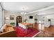 Cozy living space featuring hardwood floors, an open layout, and abundant natural light from large windows at 4322 Greenhaven Ln, Gastonia, NC 28056