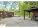 Spacious patio featuring a gazebo, brick wall, grill, and outdoor entertaining space at 4322 Greenhaven Ln, Gastonia, NC 28056