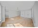 Bright bedroom features hardwood floors, neutral walls, and natural light from a large window at 4349 Castleton Rd, Charlotte, NC 28211