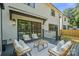 Relaxing outdoor deck area with stylish seating, perfect for entertaining and lounging at 4349 Castleton Rd, Charlotte, NC 28211