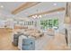 Open living space featuring kitchen, dining area, and living room with exposed beams at 4349 Castleton Rd, Charlotte, NC 28211