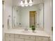 Well-lit bathroom vanity featuring white cabinetry, a large mirror, and a neutral countertop at 5051 Carillon Way, Charlotte, NC 28270