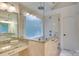 Bathroom showcasing glass shower and soaking tub with granite counters and double sinks at 5051 Carillon Way, Charlotte, NC 28270