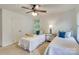 Charming bedroom with twin beds, soft carpeting, and a ceiling fan at 5051 Carillon Way, Charlotte, NC 28270