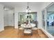 Bright breakfast nook features hardwood floors and flows into living room at 5051 Carillon Way, Charlotte, NC 28270