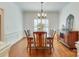 Formal dining room with classic wainscoting and a chandelier at 5051 Carillon Way, Charlotte, NC 28270