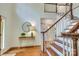 Inviting foyer with hardwood floors, a staircase, and a decorative table at 5051 Carillon Way, Charlotte, NC 28270