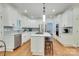 The kitchen boasts stainless steel appliances, a large island, and ample cabinet space at 5051 Carillon Way, Charlotte, NC 28270