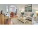 Cozy living room with neutral decor and an archway leading to the dining area at 5051 Carillon Way, Charlotte, NC 28270