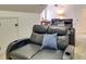 Home theater room with comfortable leather seating and a view of the screen at 5051 Carillon Way, Charlotte, NC 28270