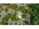 Aerial view of a wooded property surrounded by lush trees in a quiet residential neighborhood at 5205 Tedorill Ln, Charlotte, NC 28226