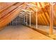 Spacious unfinished attic with exposed wood beams, offering potential for customization at 5205 Tedorill Ln, Charlotte, NC 28226