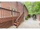 Charming backyard with a deck, patio, and lush landscaping, perfect for outdoor living at 5205 Tedorill Ln, Charlotte, NC 28226