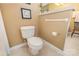Close-up of a toilet with handicap bars in neutral colored bathroom at 5205 Tedorill Ln, Charlotte, NC 28226