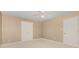 Neutral bedroom features a ceiling fan, closet, and a door leading to other rooms at 5205 Tedorill Ln, Charlotte, NC 28226