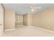 Neutral-toned carpeted bedroom offers a window and ceiling fan for a comfortable and airy feel at 5205 Tedorill Ln, Charlotte, NC 28226