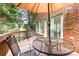 Cozy deck with metal table and chairs, ideal for relaxing and enjoying the outdoors at 5205 Tedorill Ln, Charlotte, NC 28226