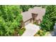 Aerial view of a brick two-story home with an attached two car garage and a paved driveway at 5205 Tedorill Ln, Charlotte, NC 28226