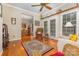 Cozy living room with hardwood floors, wicker seating, and an open view to the dining area at 5205 Tedorill Ln, Charlotte, NC 28226