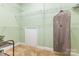 Walk-in closet with white metal shelving and doorway with carpeted floor at 5205 Tedorill Ln, Charlotte, NC 28226