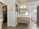 Elegant bathroom featuring a glass shower, modern vanity, stylish fixtures, and decorative ceiling at 628 Cherry St, Charlotte, NC 28204