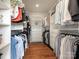 Spacious walk-in closet with custom shelving and hardwood floors offering ample storage solutions at 628 Cherry St, Charlotte, NC 28204