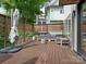 Outdoor deck with wood flooring, cozy lounge furniture, and privacy fencing provides a perfect relaxation space at 628 Cherry St, Charlotte, NC 28204
