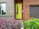 The home features a modern front door with a window, wood accents, and neat landscaping at 628 Cherry St, Charlotte, NC 28204