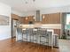 Modern kitchen with stainless steel appliances, wood cabinets, a large island, and pendant lighting at 628 Cherry St, Charlotte, NC 28204