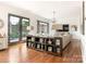 Open-concept living room featuring hardwood floors, modern decor, and a walkout patio at 628 Cherry St, Charlotte, NC 28204