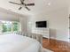 Bright main bedroom with a large window, hardwood floors, a ceiling fan, and a dresser at 628 Cherry St, Charlotte, NC 28204