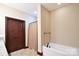 Bathroom showcasing a soaking tub, tile flooring, and a separate shower for a relaxing experience at 670 Cricket Ln, Mt Ulla, NC 28125