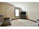 Cozy bonus room with angled ceilings, carpeted floors, and a window for natural light at 670 Cricket Ln, Mt Ulla, NC 28125