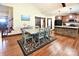 Hardwood floors in an open floor plan with a dining area and an island kitchen at 670 Cricket Ln, Mt Ulla, NC 28125