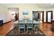 Hardwood floors in an open floor plan with a dining area and stairs to the left at 670 Cricket Ln, Mt Ulla, NC 28125