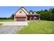 Charming craftsman-style home with a covered front porch, two-car garage, and a well-maintained lawn at 670 Cricket Ln, Mt Ulla, NC 28125